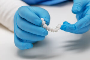 a dentist working on full arch dental implant prosthesis
